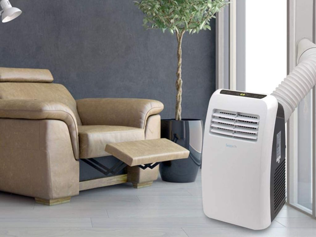 A portable air conditioner in a living room.