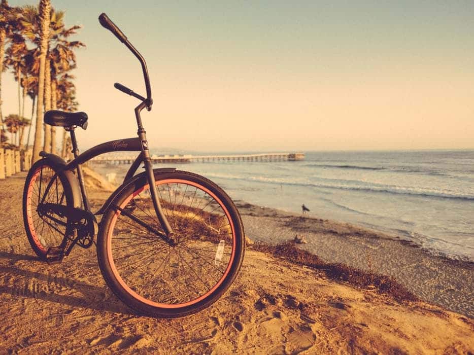 Beach cruiser bike on sandy beach
