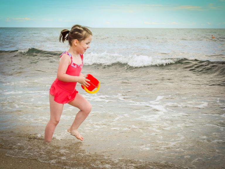 Girl running on beach