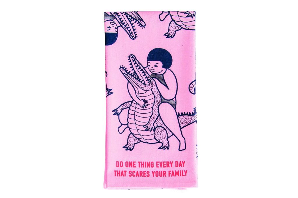 Girl battling gator dish towel