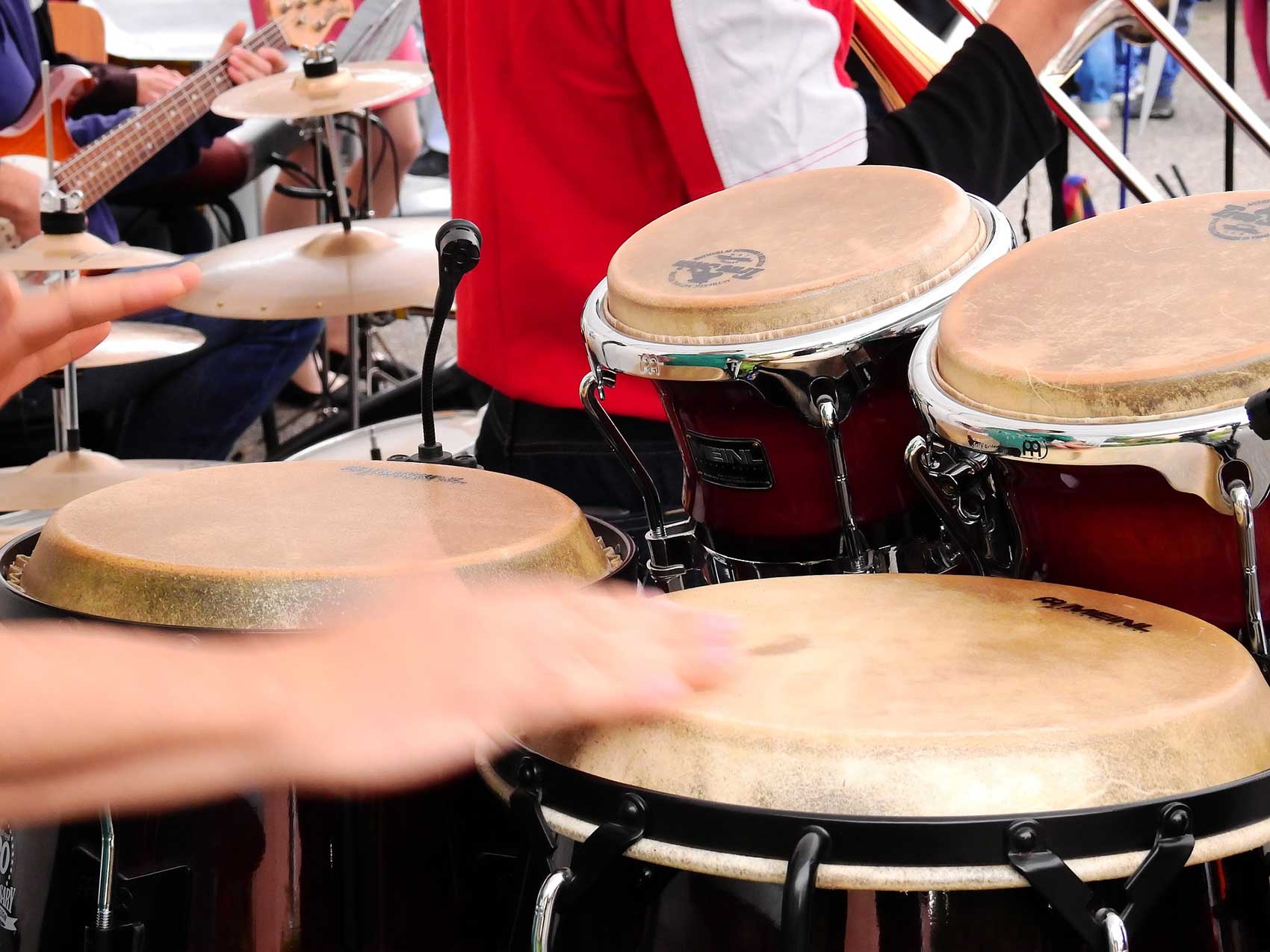 people playing bongos