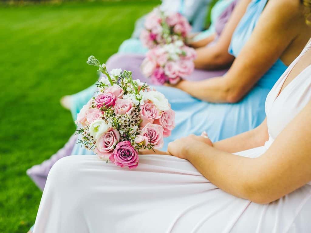 Bridesmaid wait with flowers