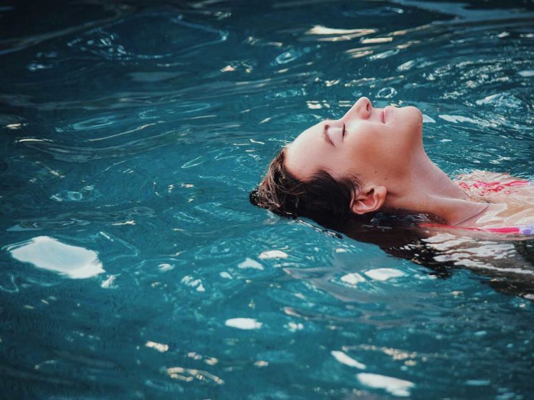 Woman floating in water.