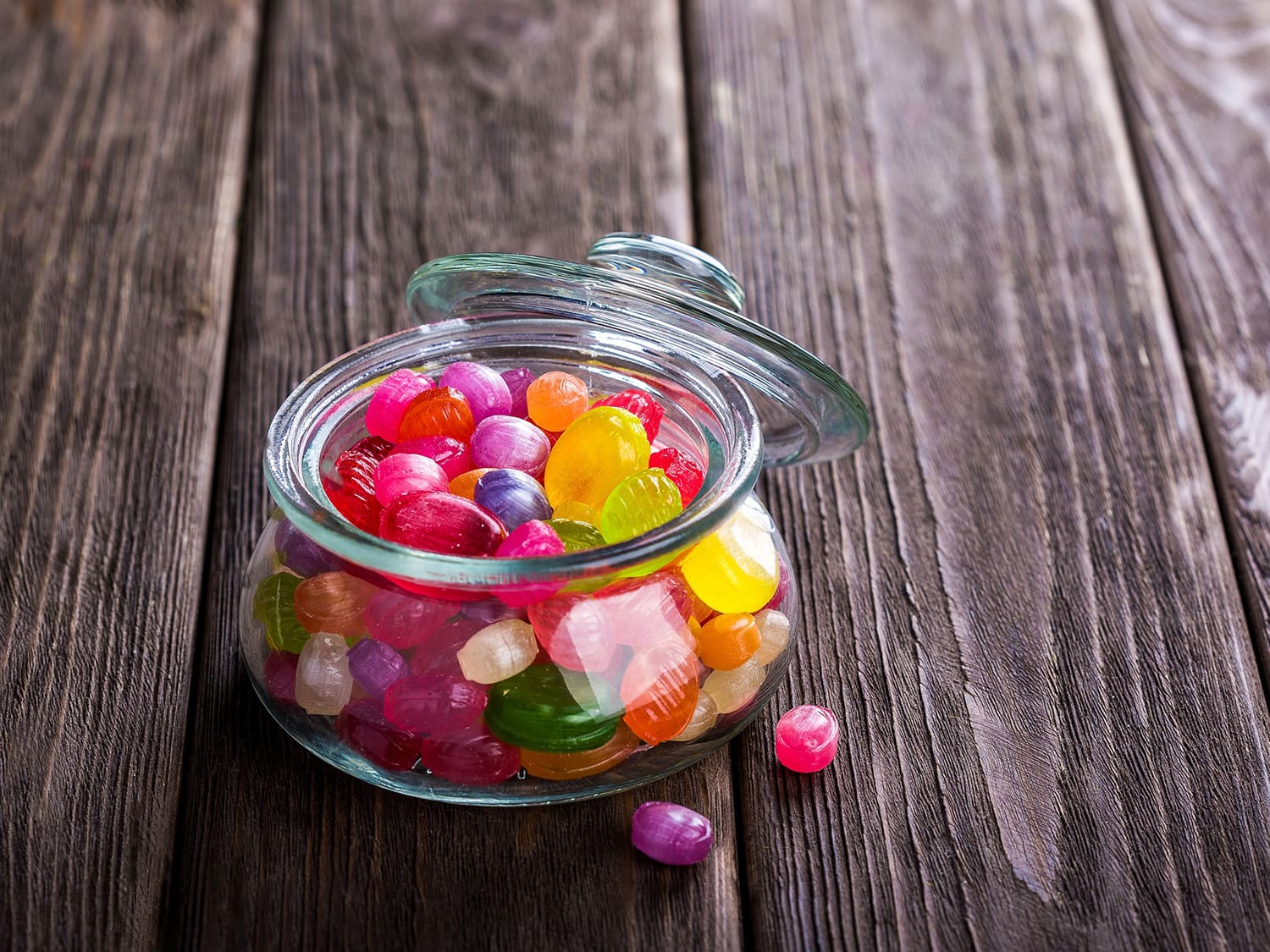 jar of candy on a wood table
