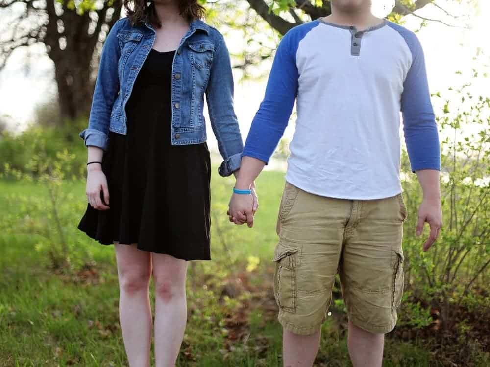 Woman and man wearing cargo shorts.