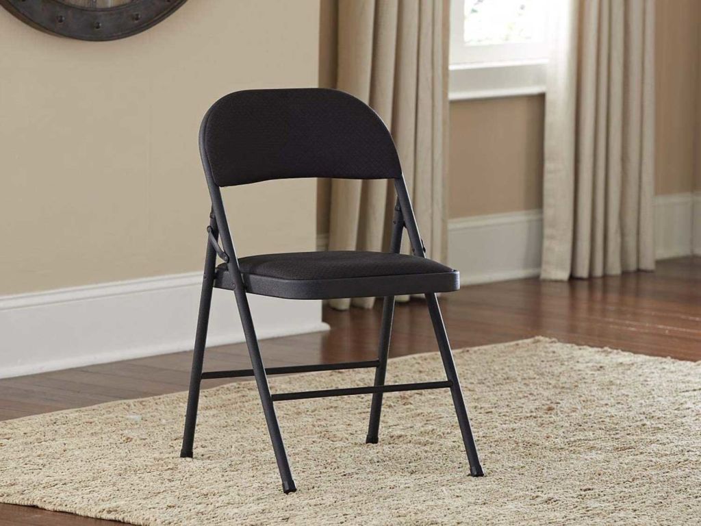 A folding chair sitting in the living room.