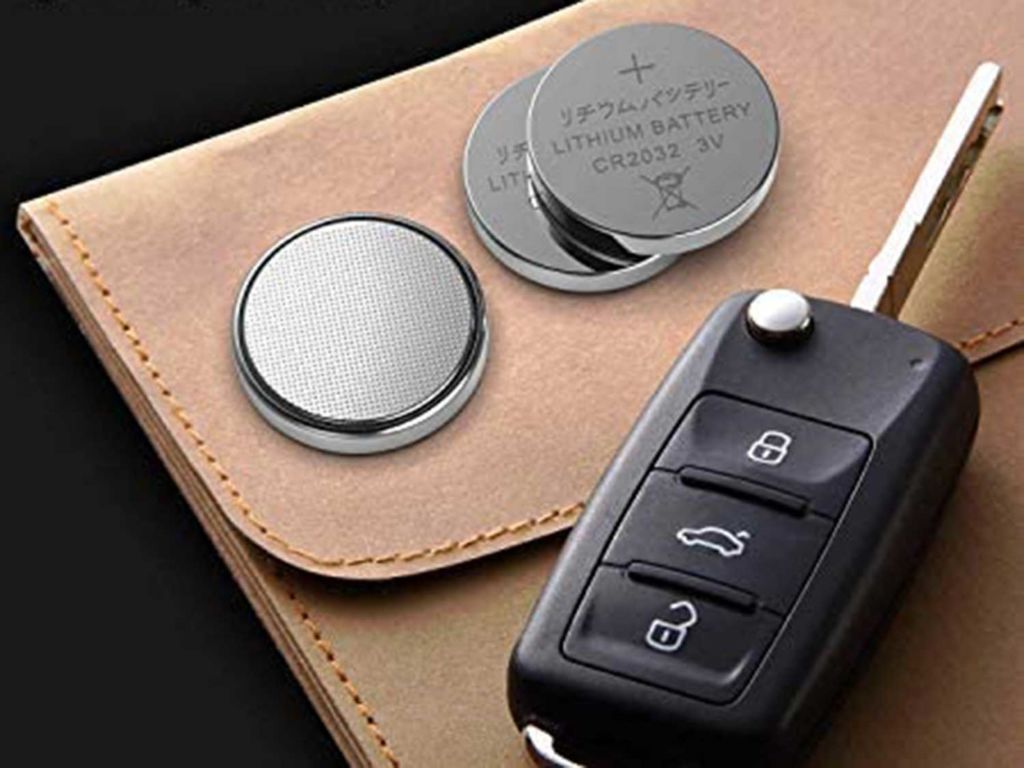 Coin battery next to a car key
