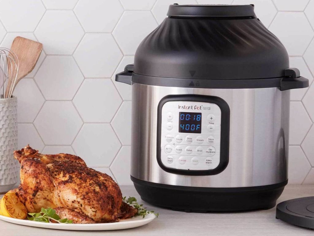 Combination pressure cooker and air fryer on a kitchen counter.