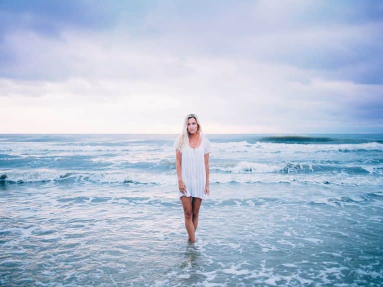 Woman wearing a cover up on the beach