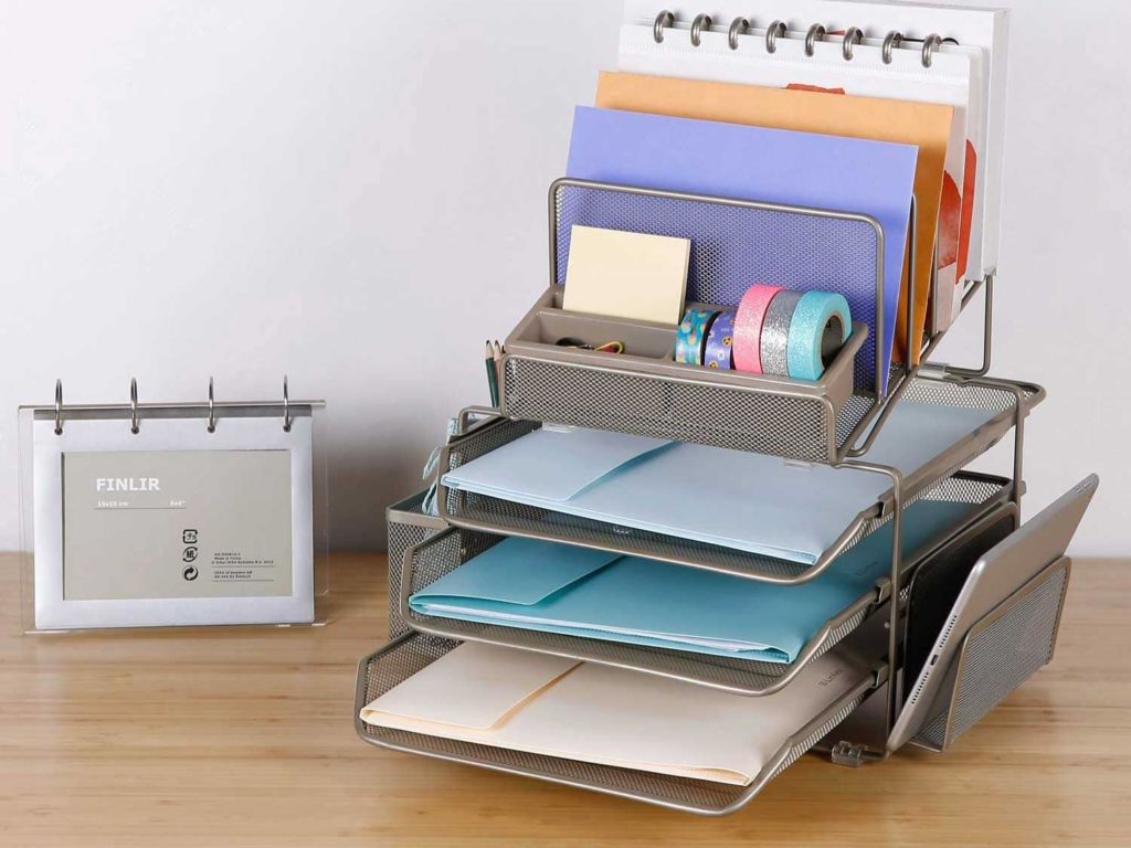 Desk organizer full of folders sitting on a desk.
