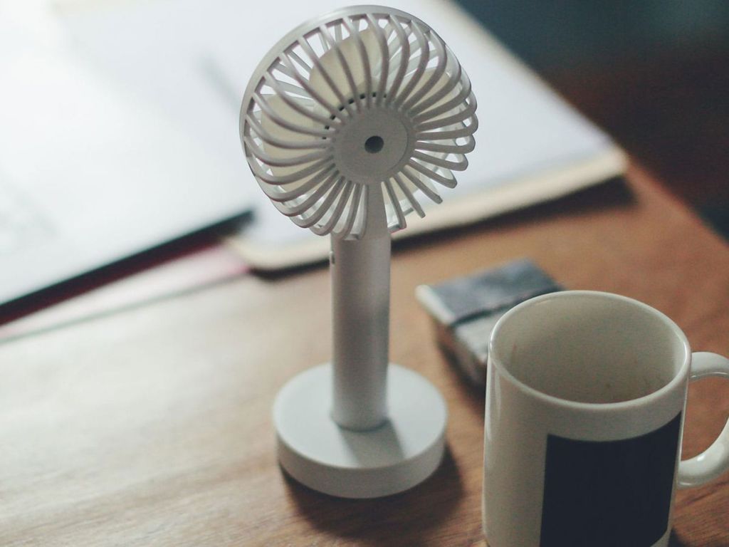 Small fan on a desk.