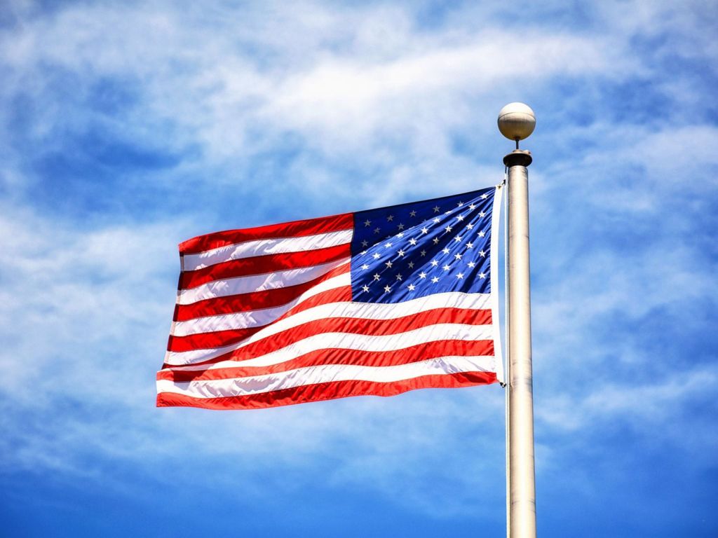 US flag flying on a flag pole.