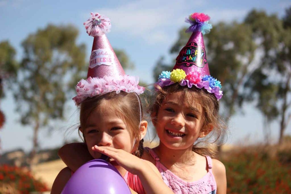 Two girls at a birthday party