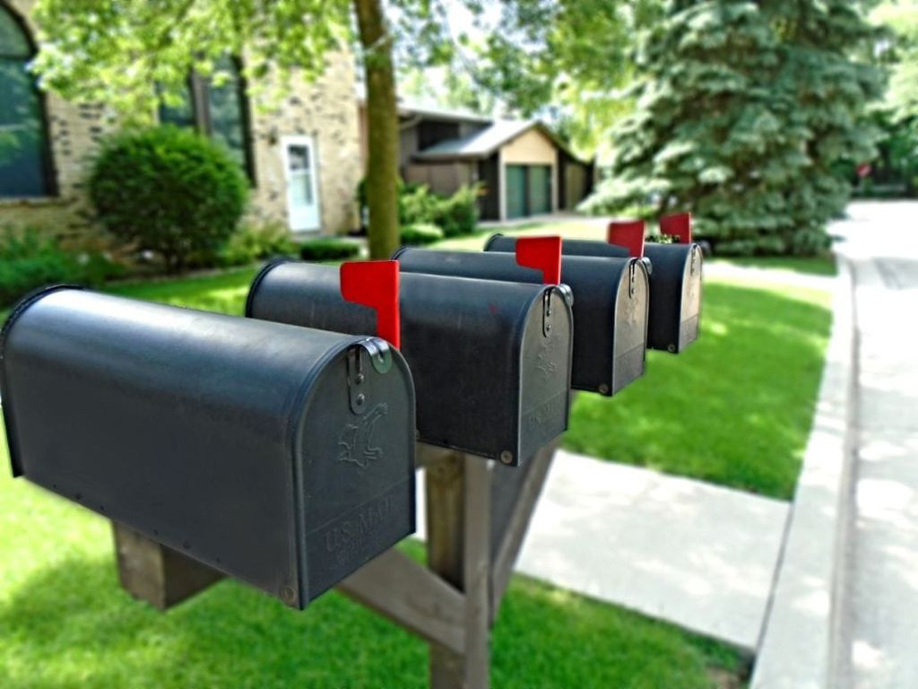 A row of mailboxes on a street