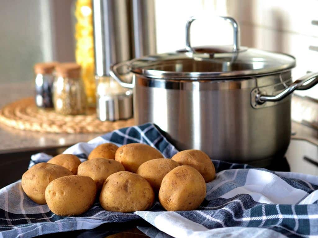 Potatoes and a pot in a kitchen