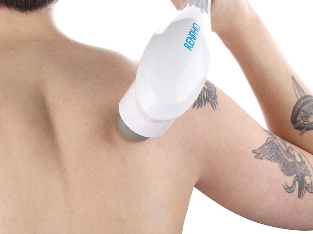 Man using handheld back massager