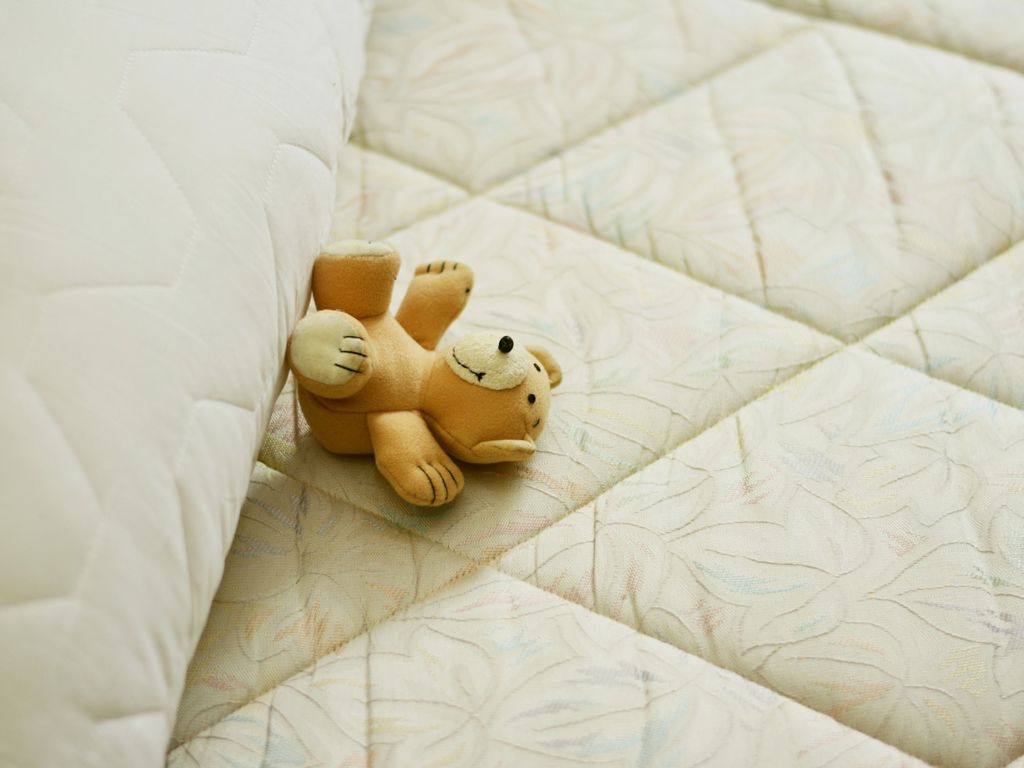 Teddy bear on a mattress