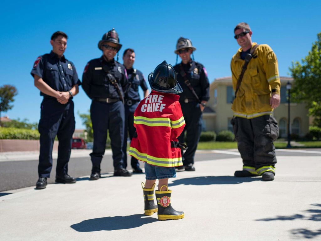 Firefighters and child