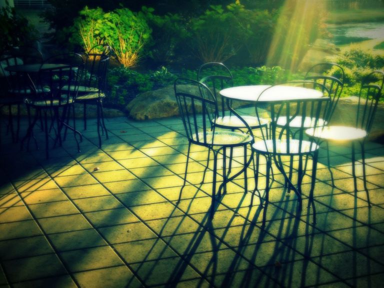 A patio table in the early morning sun