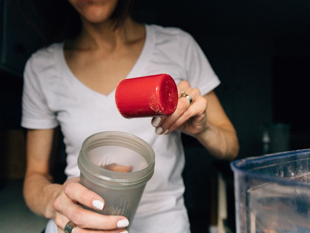 Woman making a protein shake