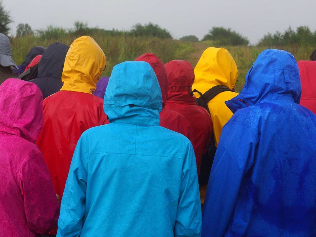 Different colored rain jackets on a cloudy day