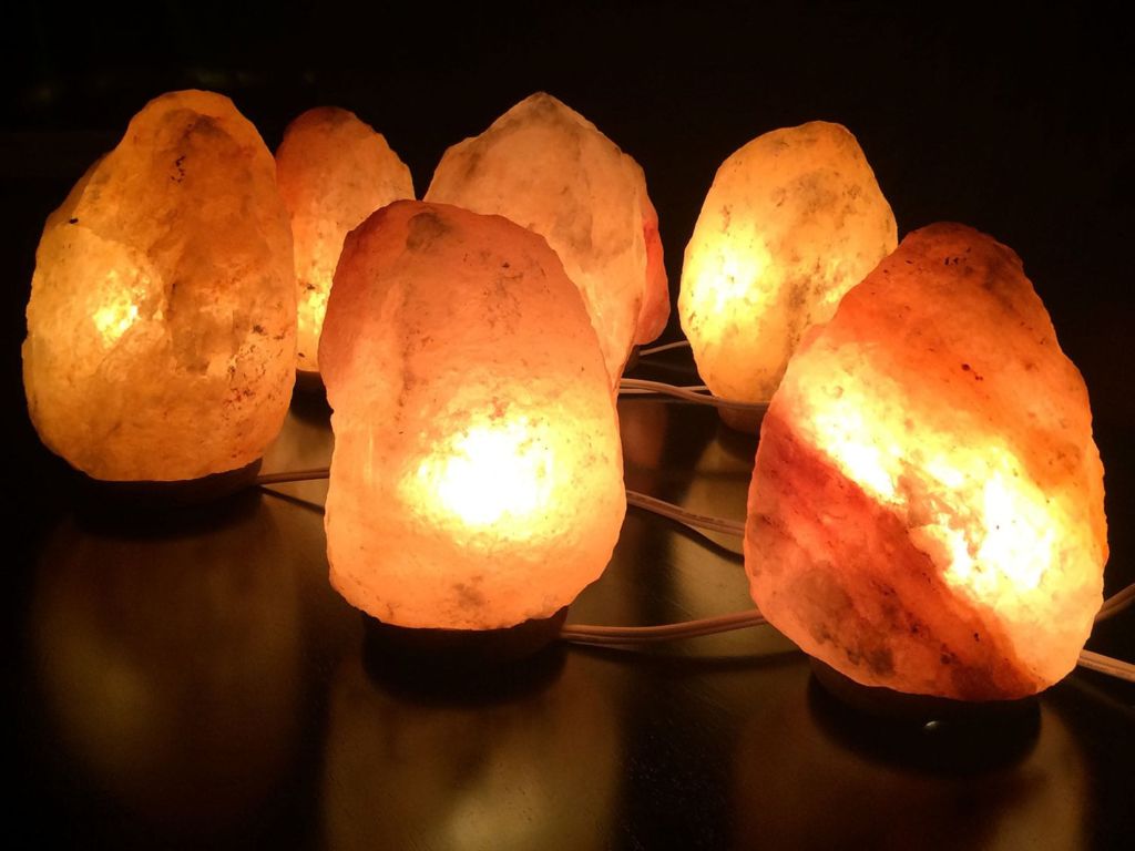 Group of salt lamps turned on.