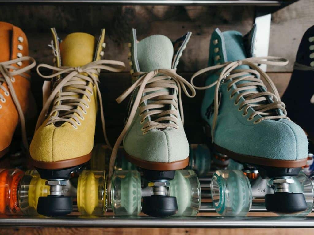Roller skates lined up on a shelf