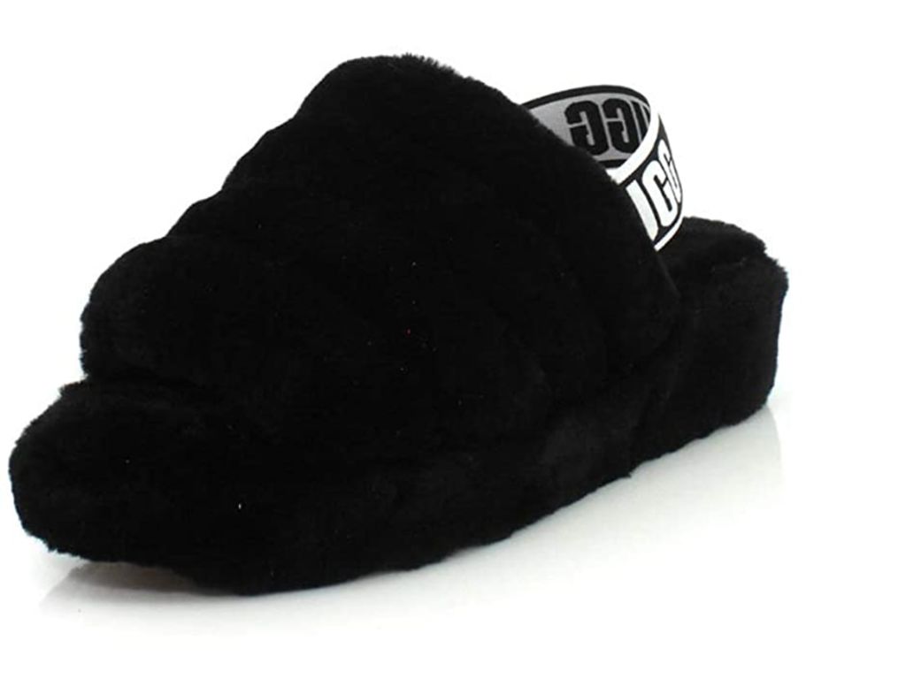 This combo slipper/sandal is made of sheepskin and has a platform sole.