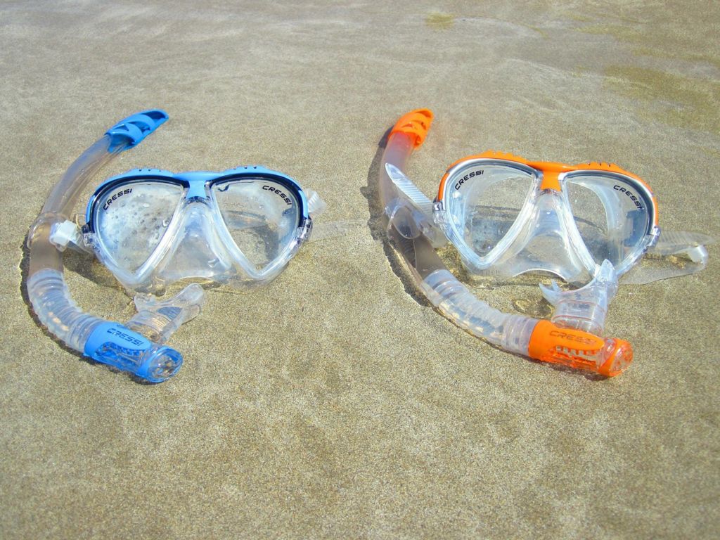 Masks and snorkels on the sand