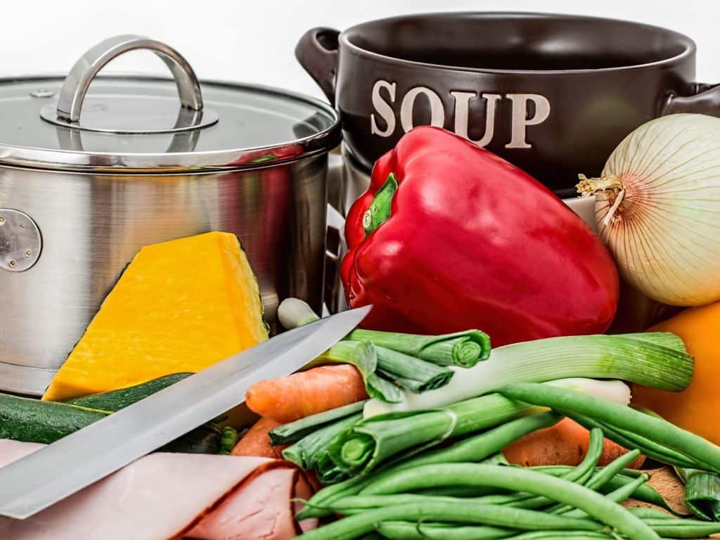 Ingredients for soup and a soup pot