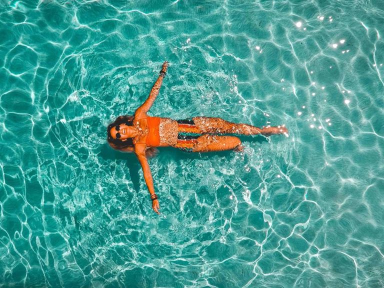 Woman floating in a swimming pool