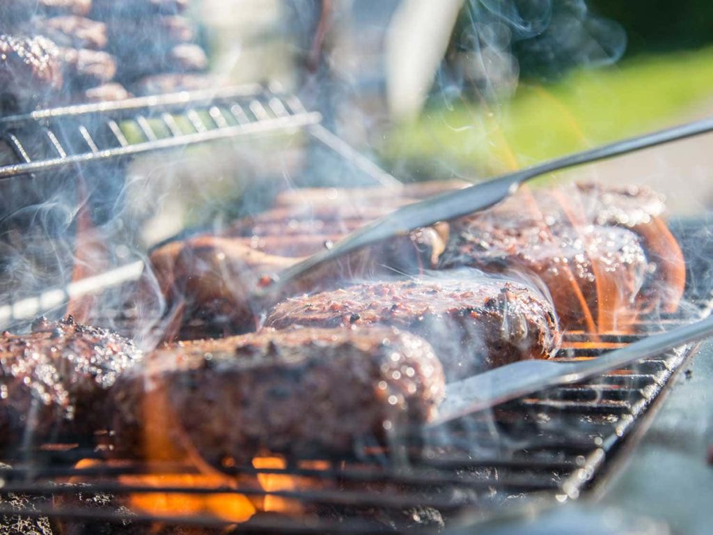 Grilling burgers outdoors