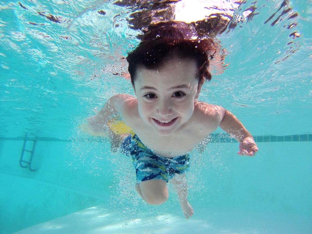 Boy underwater in a pool