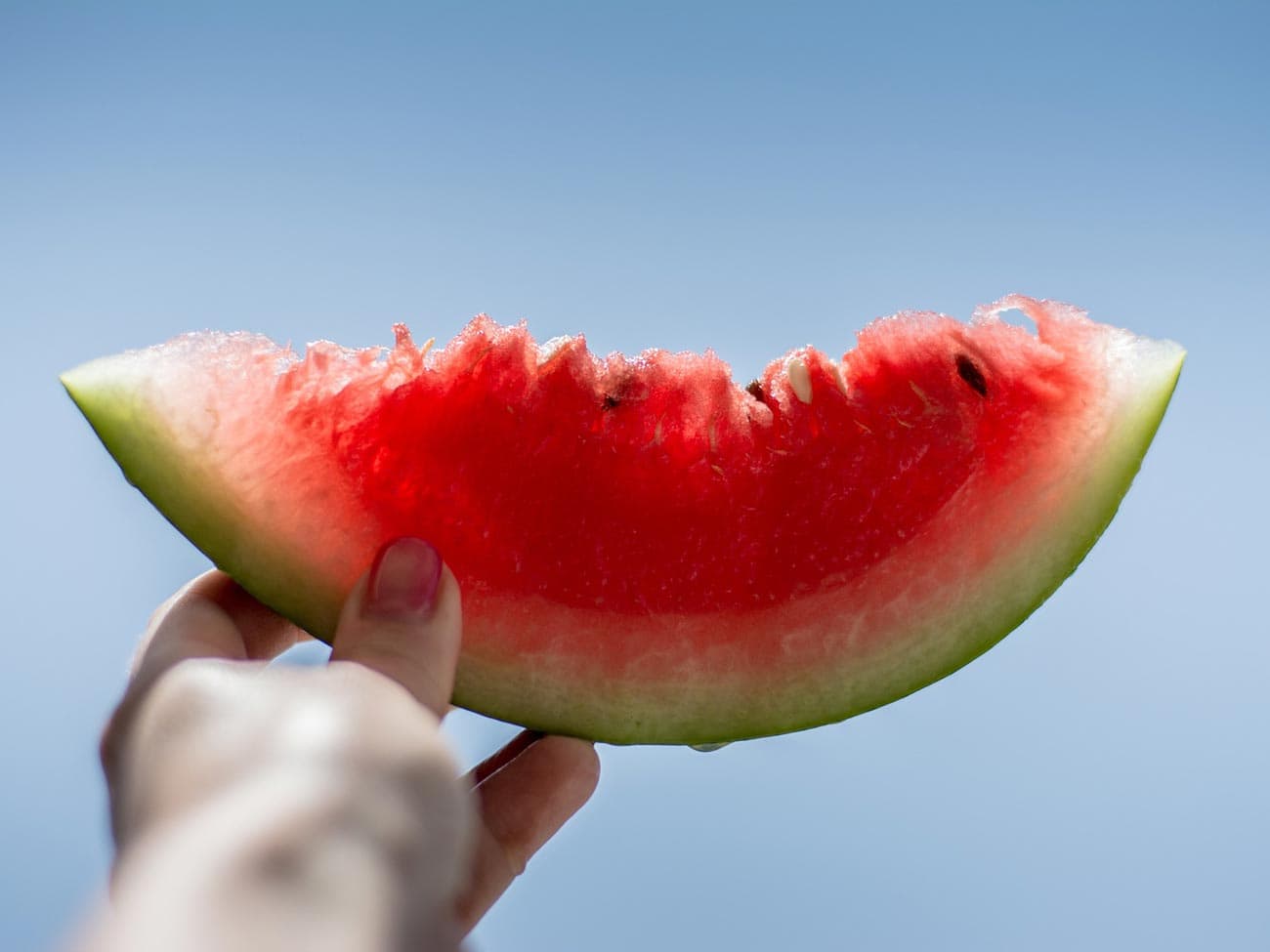 watermelon in womens hand