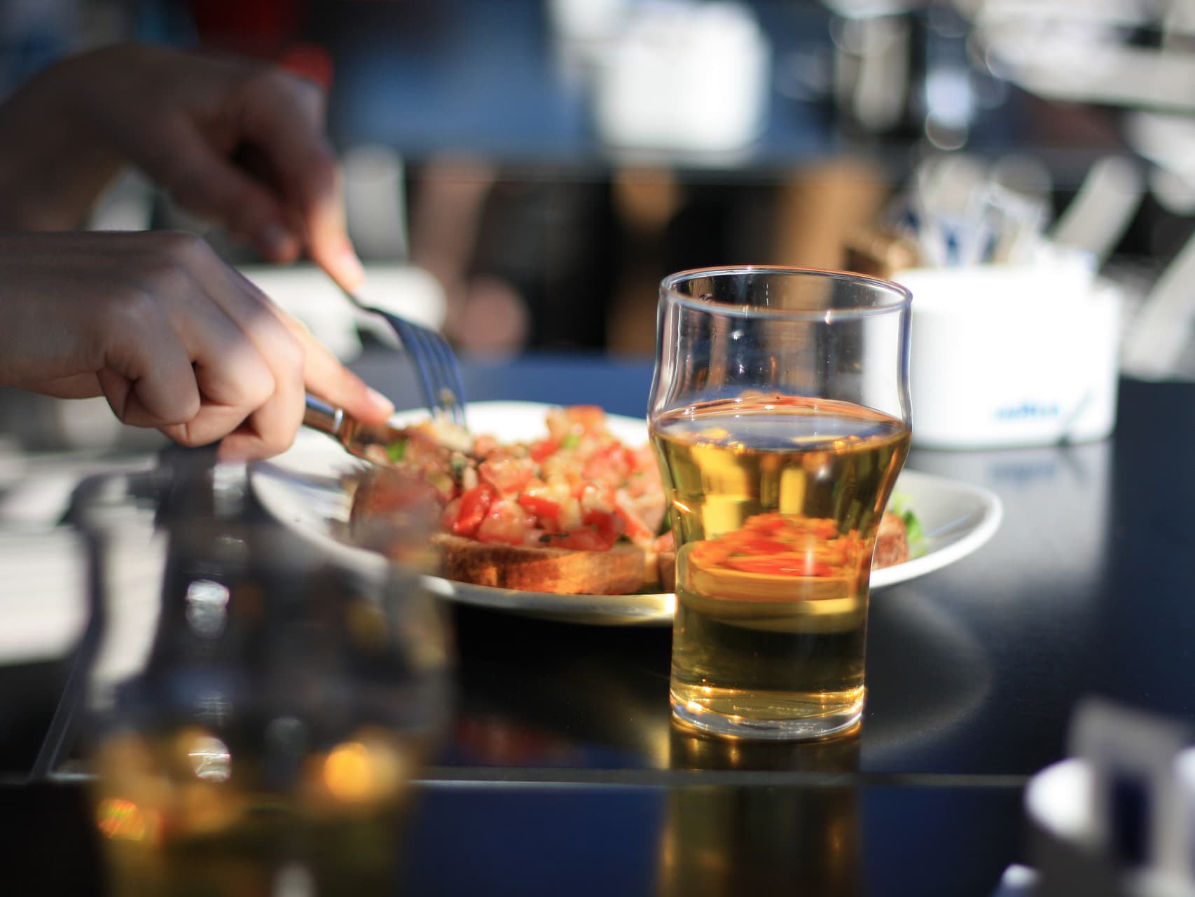 person eating and having a beer