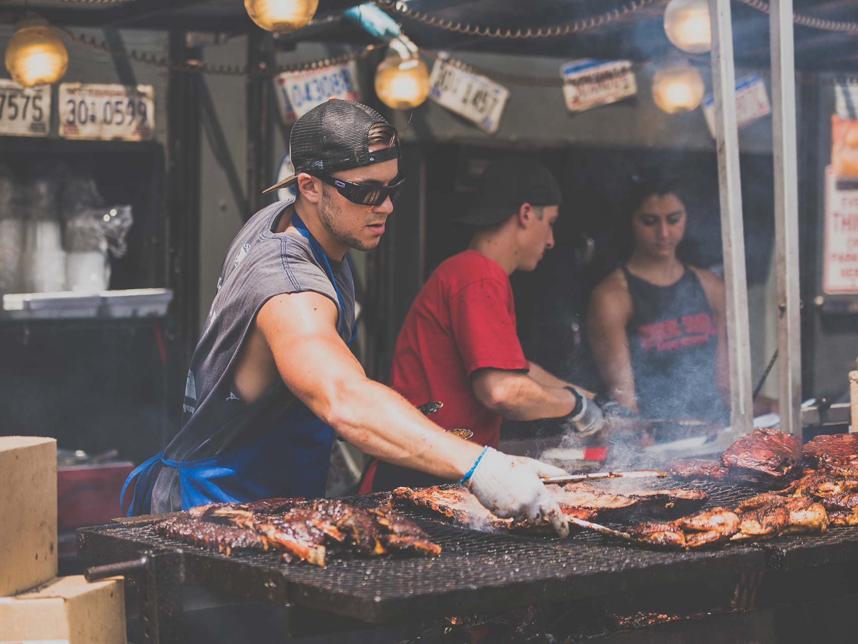 man grilling ribs