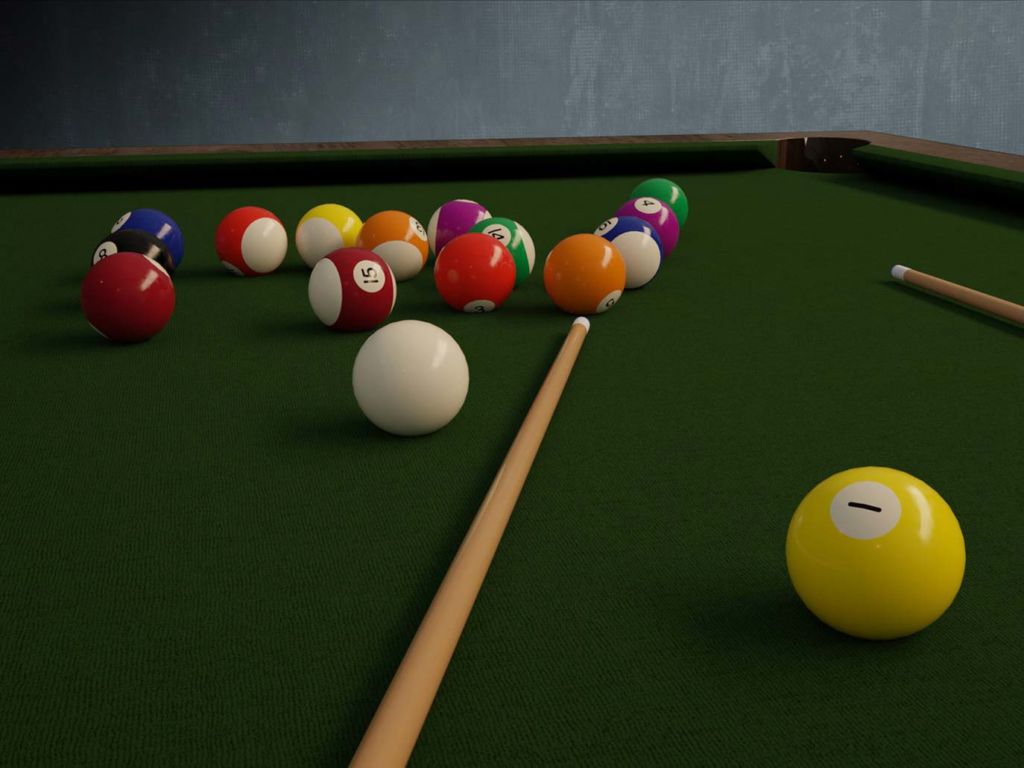 A collection of billiard balls on a billiards table.