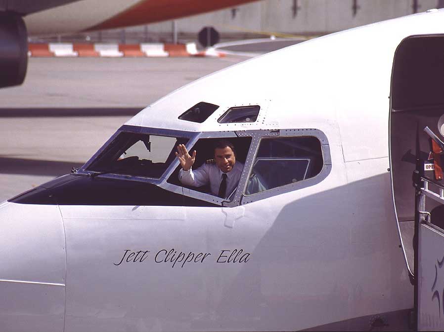 John Travolta piloting a plane.