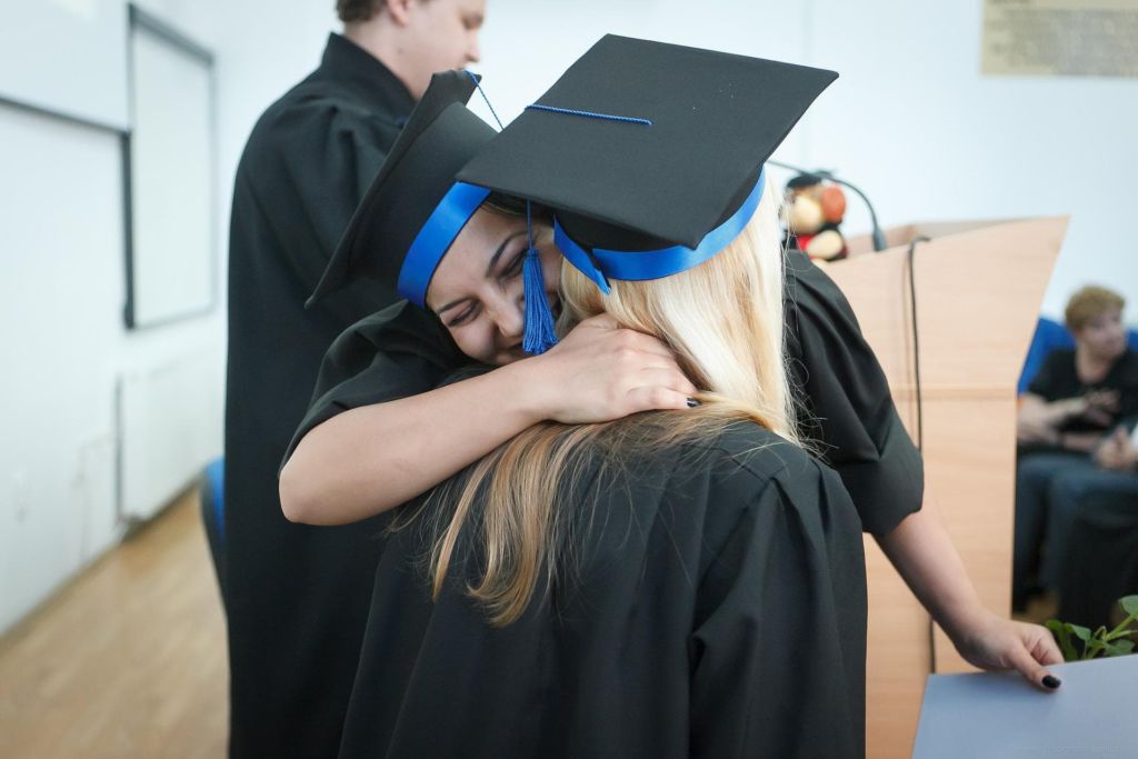 Two women celebrating graduating.