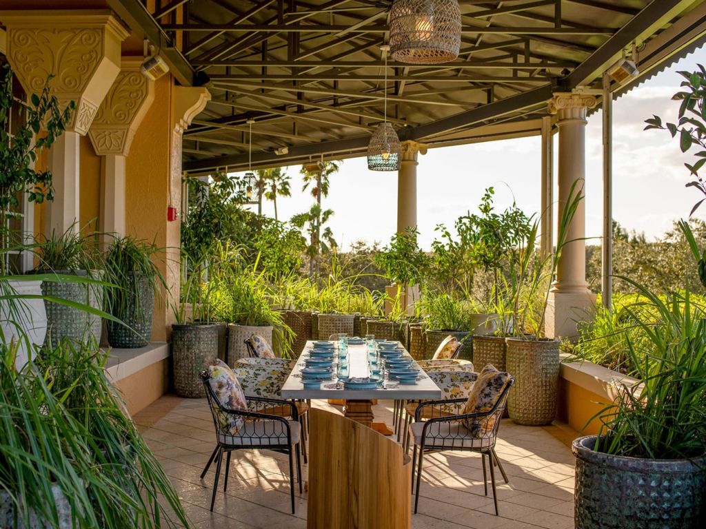 An outdoor garden dining aarea at The Ritz-Carlton Orlando