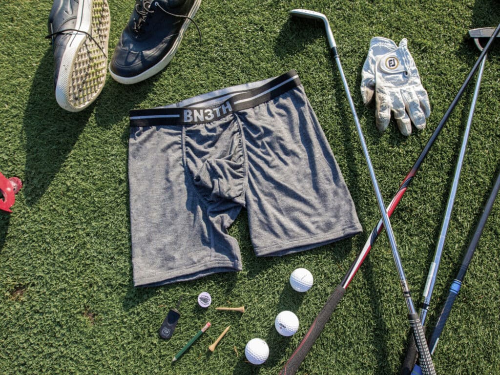 A pair of BN3TH Infinite Boxer Briefs with other golf gear.