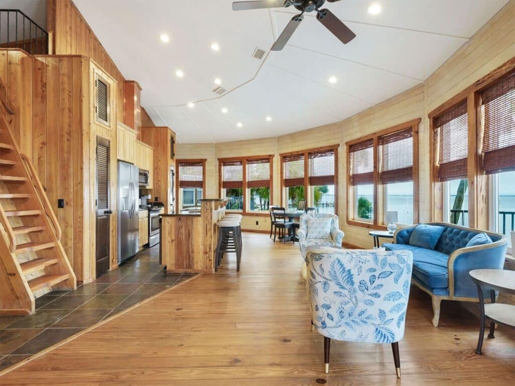 An interior view of the kitchen and dining space in a beachside bungalow on Black’s Island in Florida.