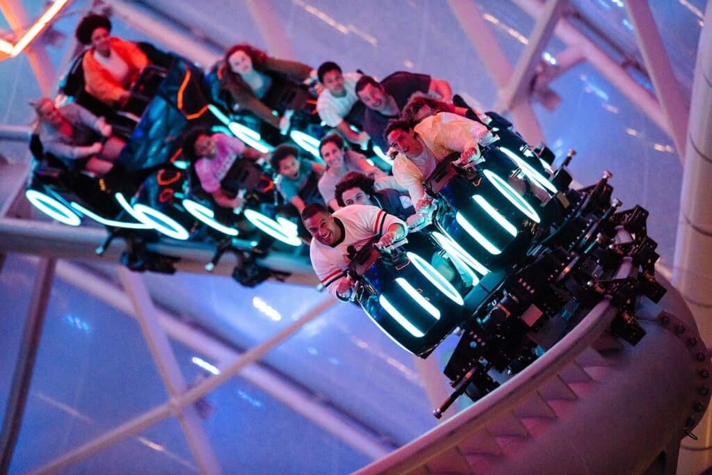 Guests rocket through the attraction on the TRON coaster at the Magic Kingdom.