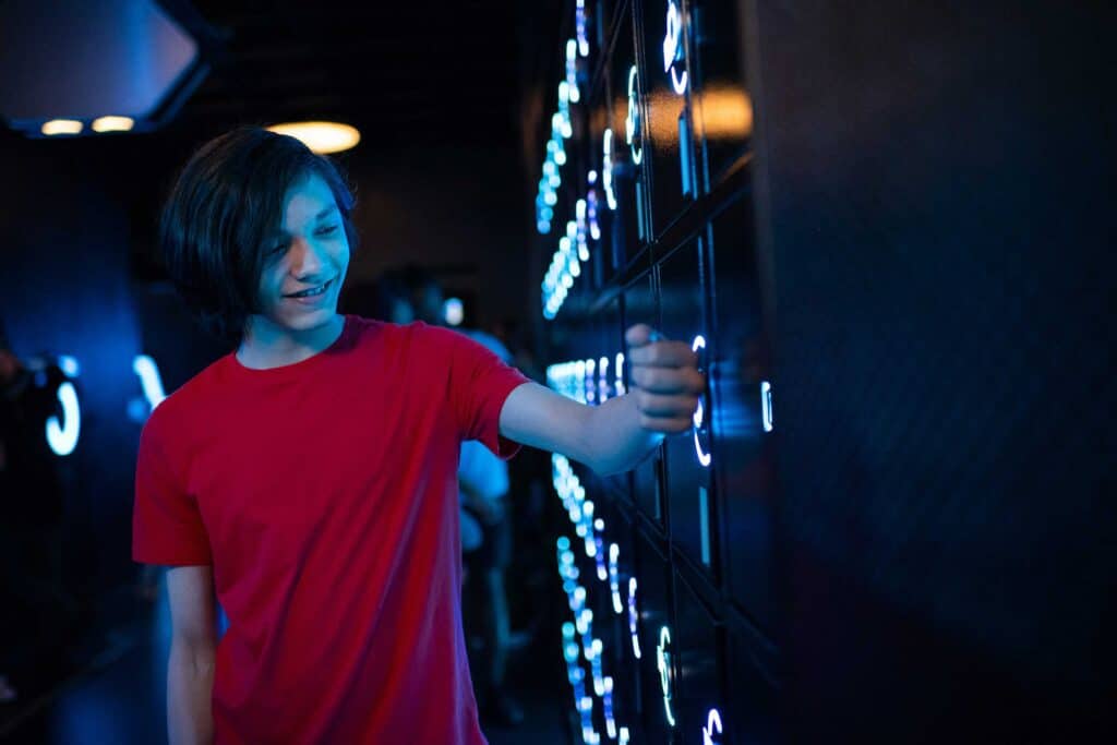 Free lockers are provided - and required - for guests' belongings before boarding TRON. They can be opened with a MagicBand.