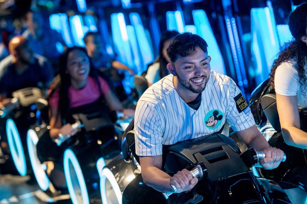Guests ride the TRON coaster as they sit in “motorcycle” style in the cars.