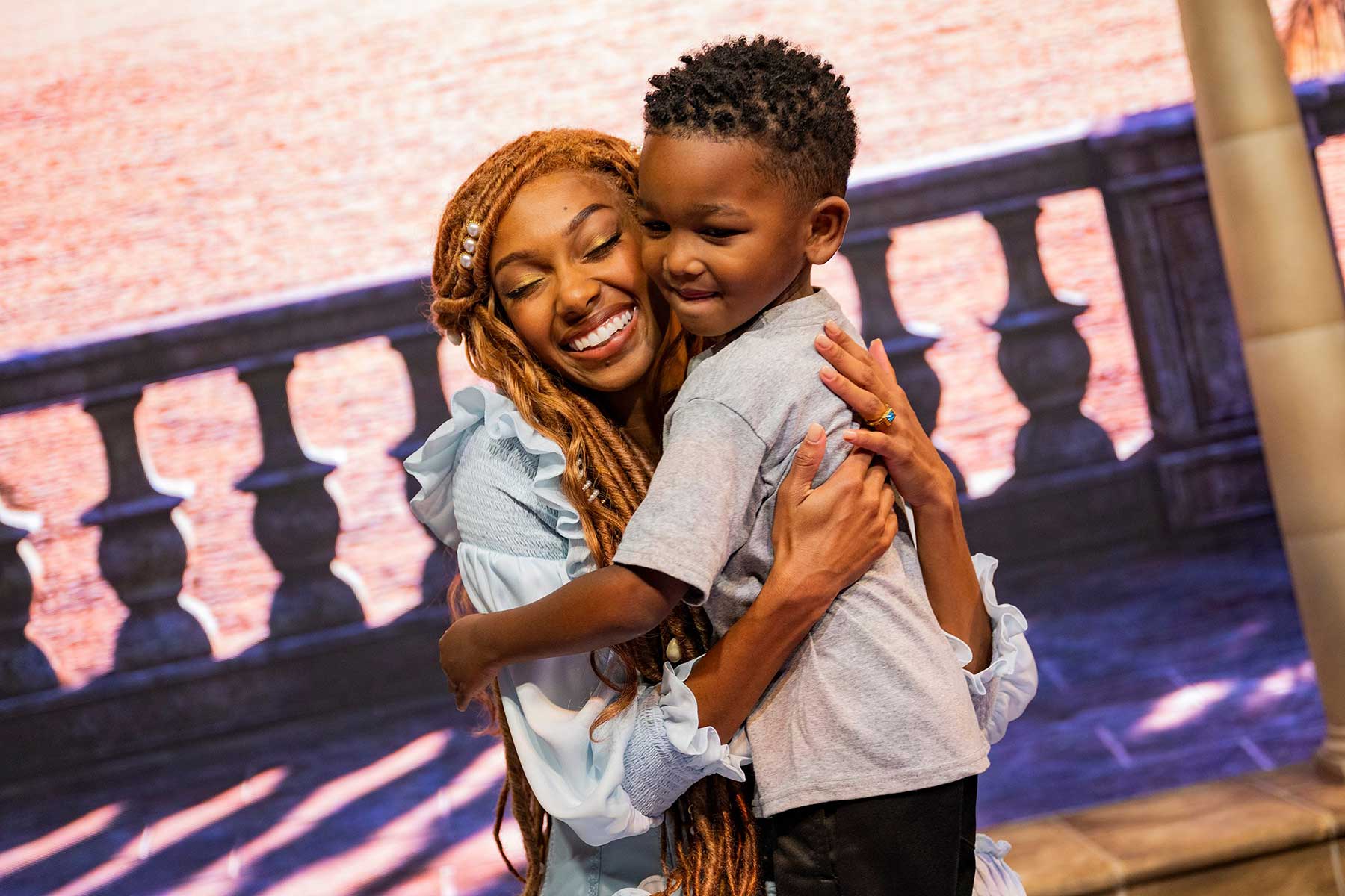 Ariel greets a young guest at Disney’s Hollywood Studios.