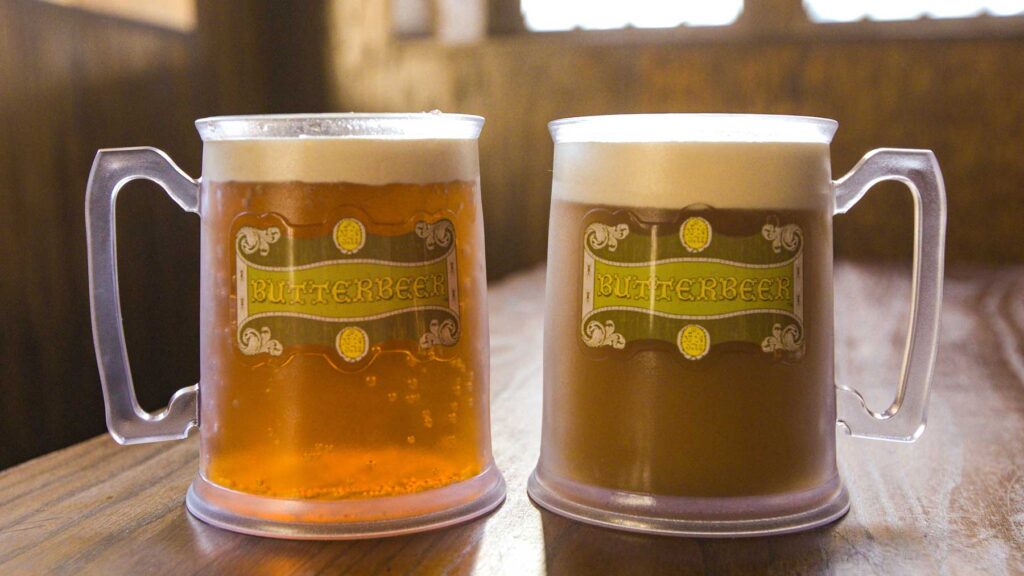 Two glasses of vegan butterbeer await guests.