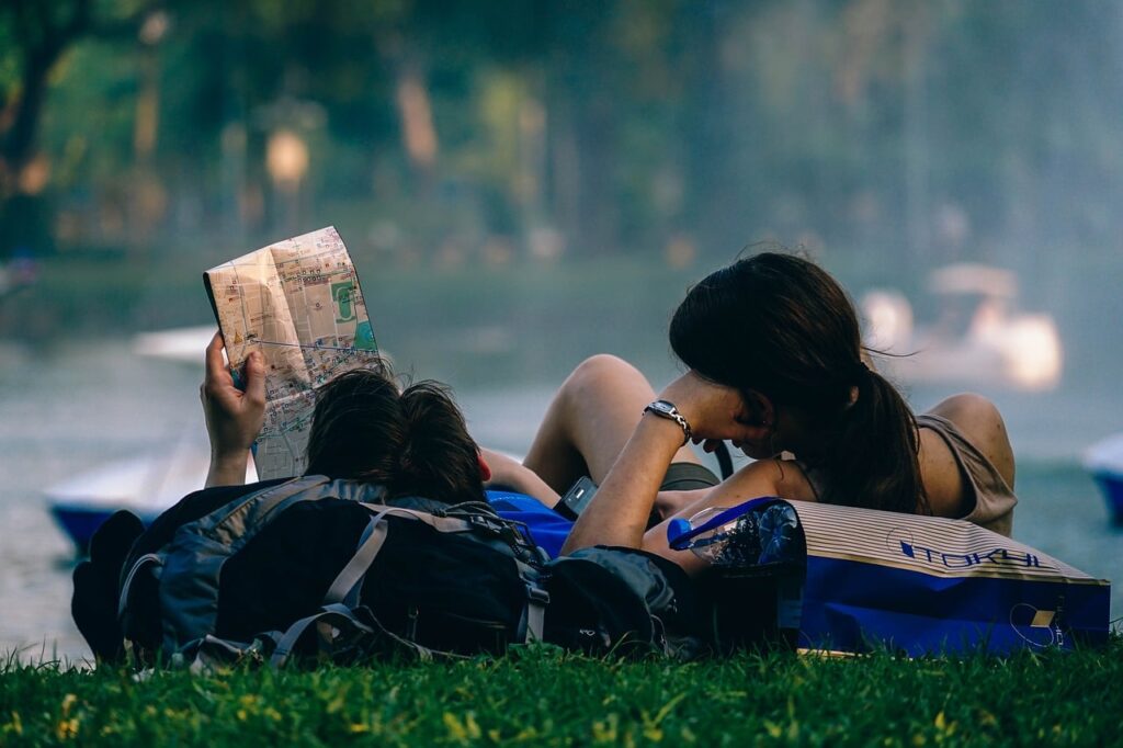 Two travelers look at a map