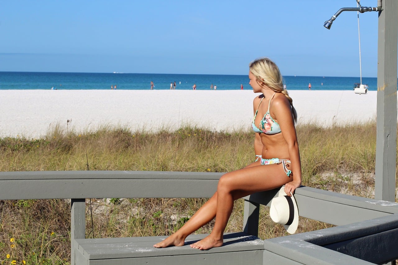 Girl sitting near the beach