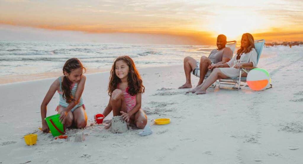 Family playing on the beach